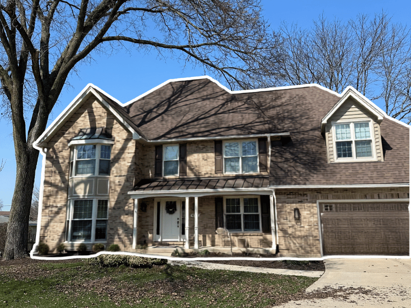 Glen Ellyn home after metal roof installation was requested to complement the new bay window