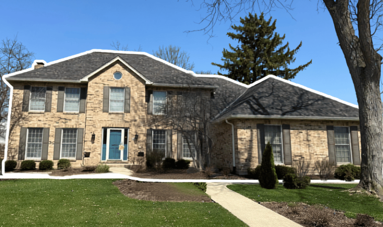 New roof replacement with metal valleys and new gutters on previously storm-damaged Glen Ellyn home
