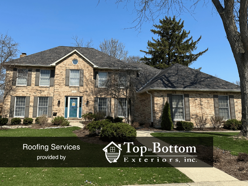 Glen Ellyn roof replacement with metal valleys and new gutters after storm damage