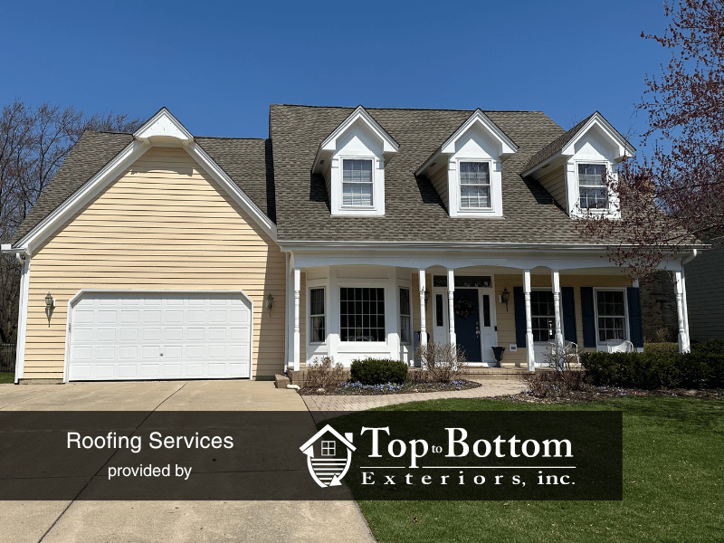 Wheaton home after storm restoration including new roof, gutters, and siding, plus fresh cedar siding paint