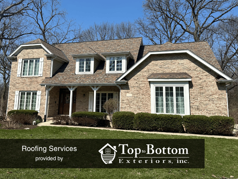 St. Charles home with new roof replacing warped, curling shingles on sloped roof