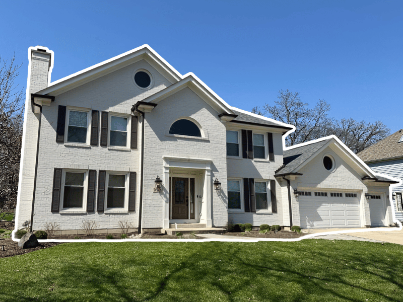 Wheaton home with new roof and modern gutters to stop water damage